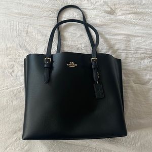 Like NEW COACH Black Leather Tote with Gold details.